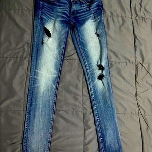 Buckle Women's Skinny Jeans - Blue Distressed